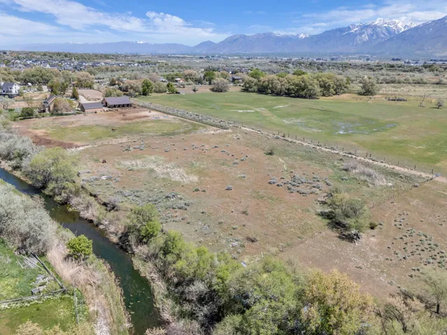 Expansive acreage featuring natural landscaping and a water canal
