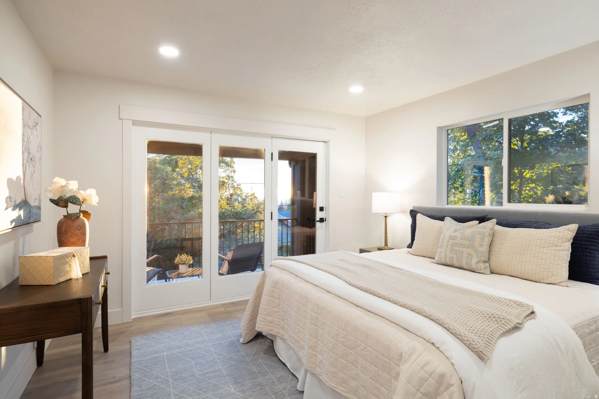 Bedroom featuring light wood-finish flooring, recessed lighting, and white trim