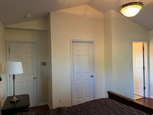 Vaulted ceilings featuring a flush-mount light fixture