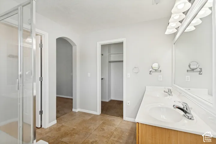 Dual sink vanity with white countertop and chrome fixtures