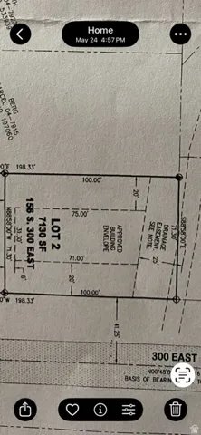 Plat Map. Illustrating lot dimensions, building envelope, and drainage easement for the property