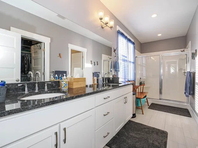 Dual vanity with integrated sinks and dark countertop