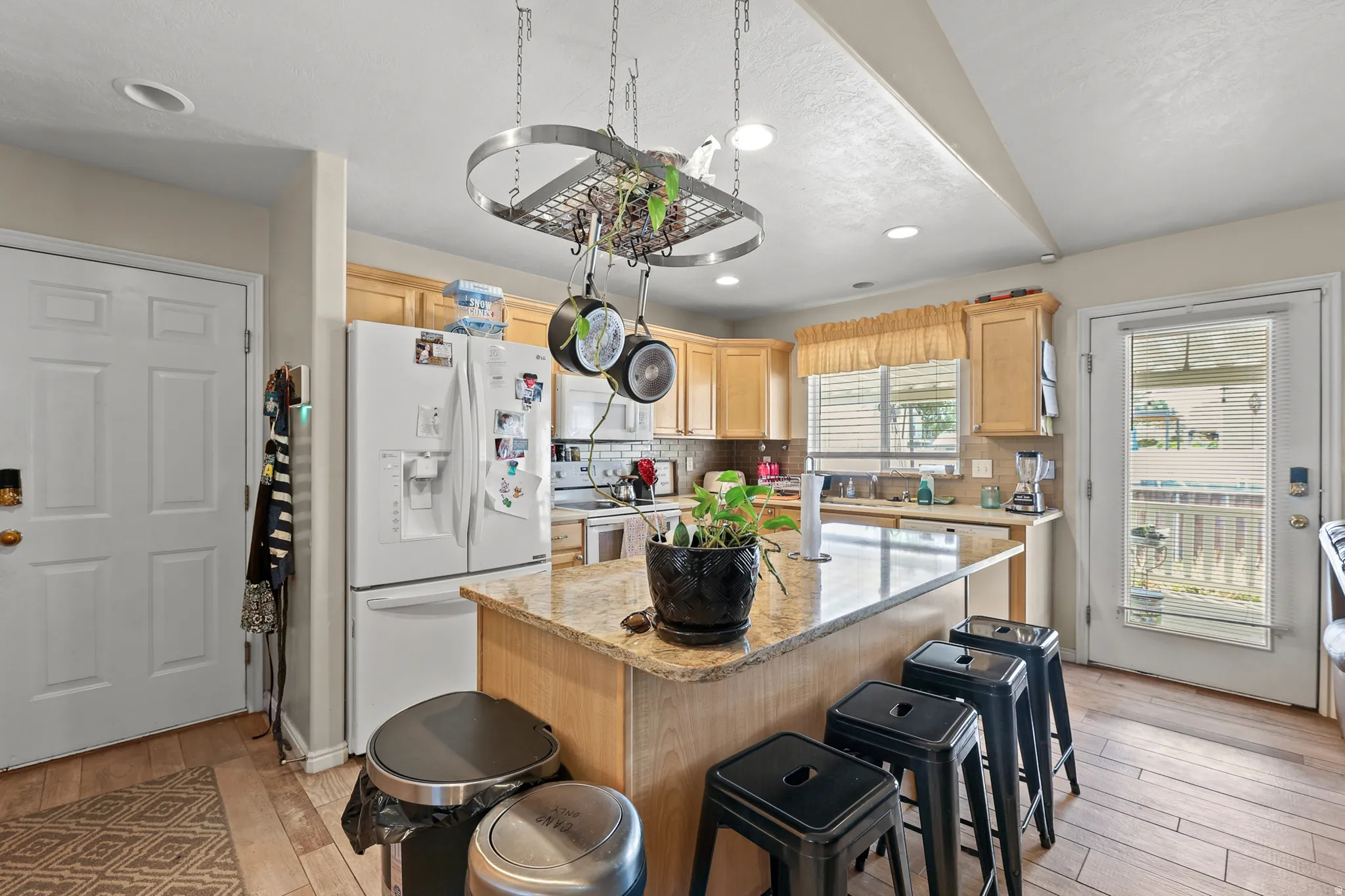 spacious kitchen with easy access to back deck and garage