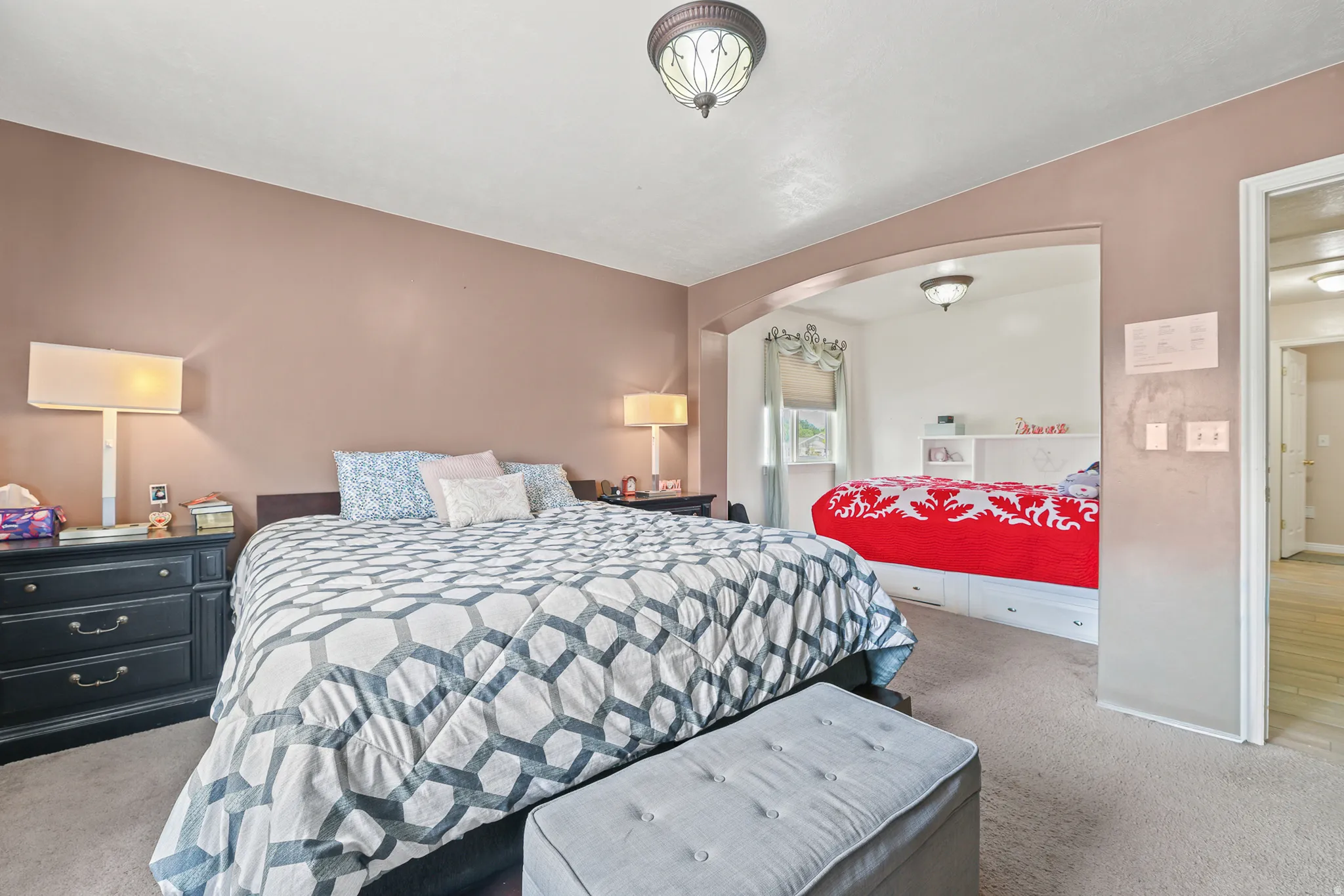 The spacious primary suite features a versatile bonus room perfect as a private sitting area, nursery, home office, fitness space, reading retreat, or even a potential additional bedroom!