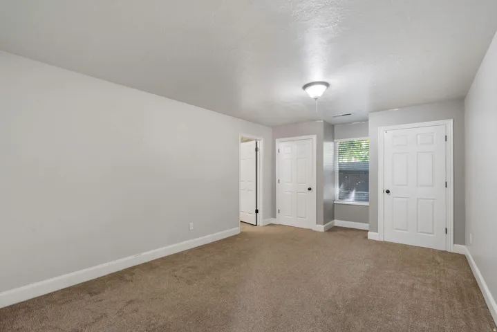 Room featuring neutral carpeting and light gray walls