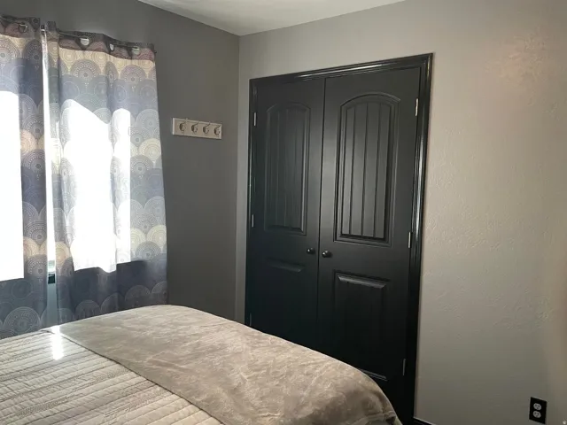 Double bi-fold closet doors with panel detailing