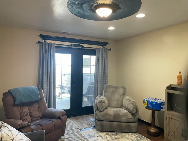 French doors with decorative trim, recessed lighting, and a detailed ceiling medallion