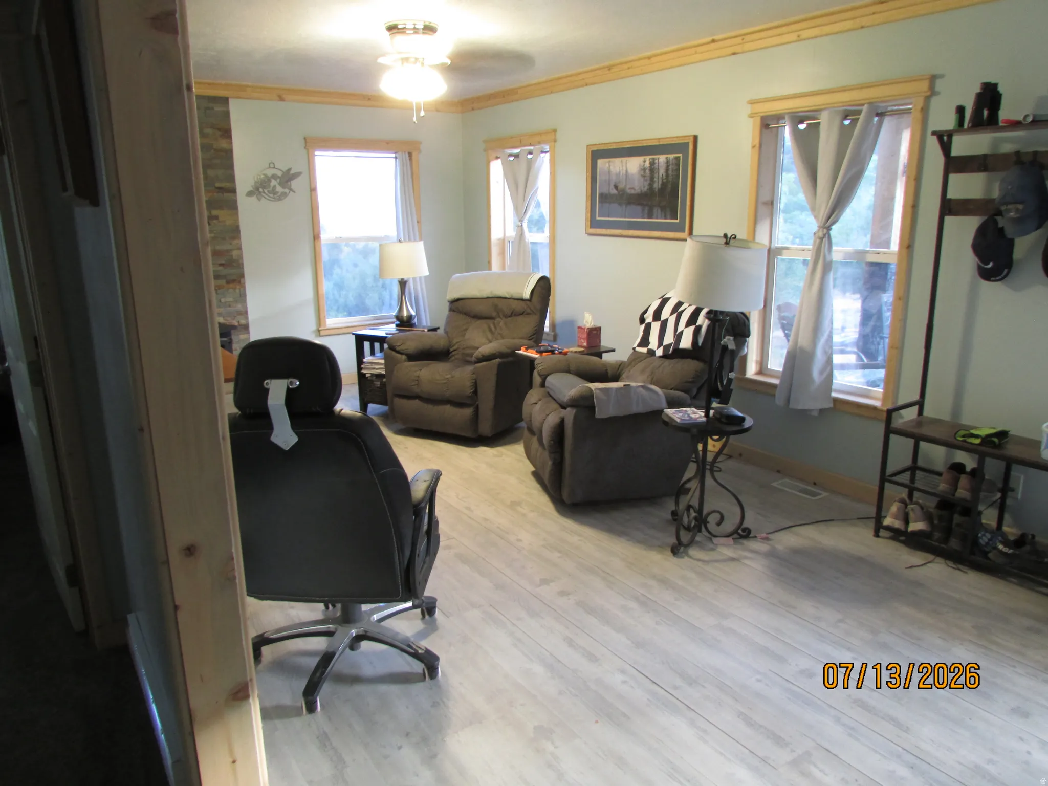 Living area featuring wood-finish flooring and light blue walls