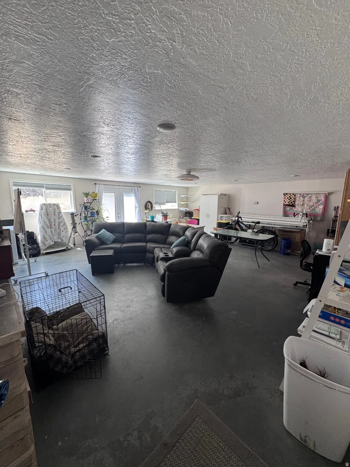 Spacious open area featuring durable concrete flooring