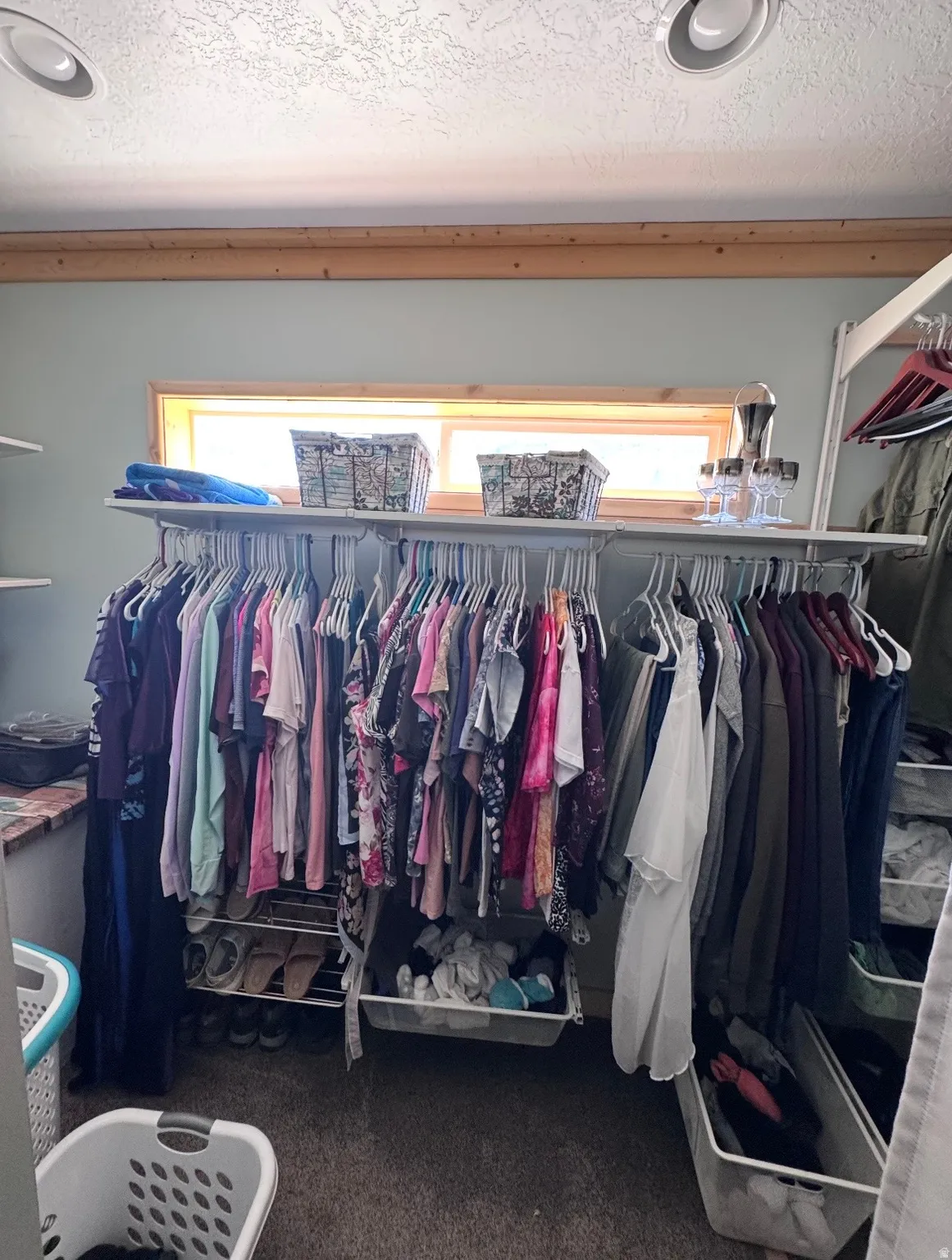Built-in shelving and hanging rods with integrated window