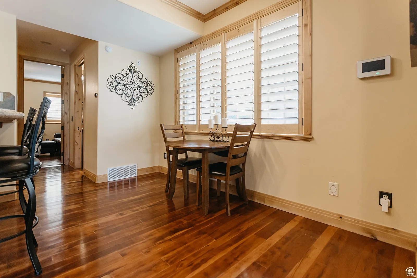 Hardwood-finish flooring throughout, complemented by light-toned walls and wood trim