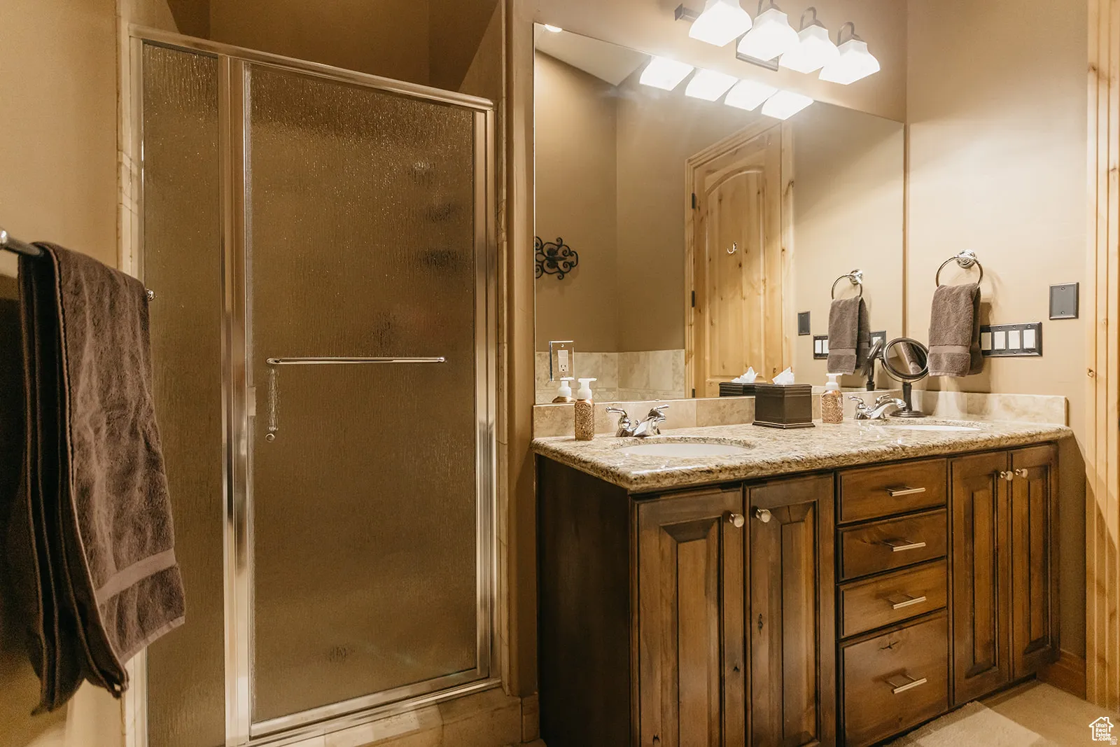 Dual vanity with stone countertop and undermount sinks
