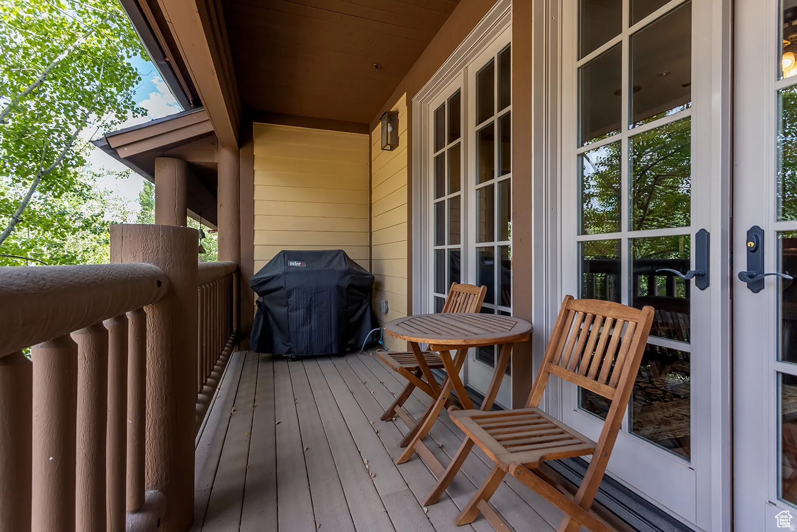 Outdoor deck with wood flooring and robust wood railings