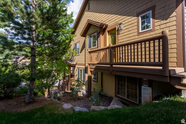 Multi-level exterior with shingle siding and contrasting trim