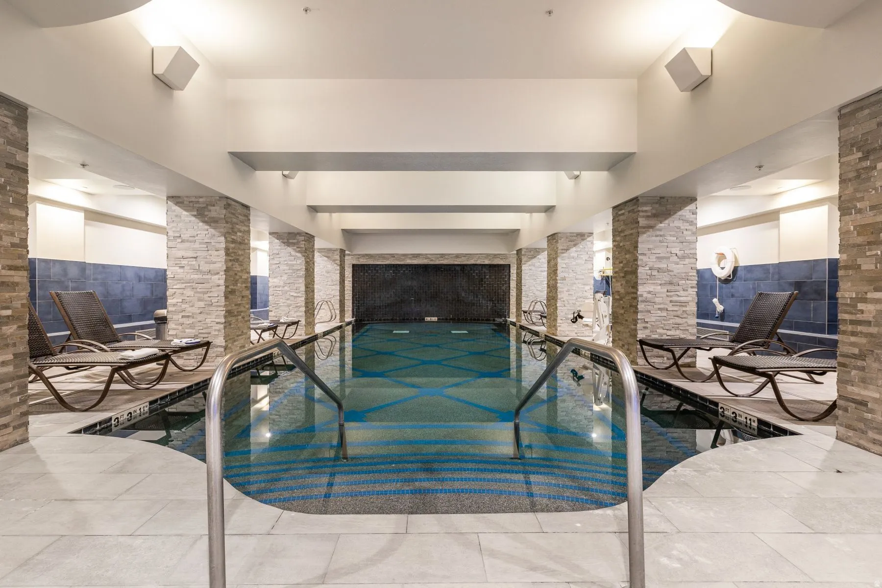 Indoor swimming pool with mosaic tile detailing