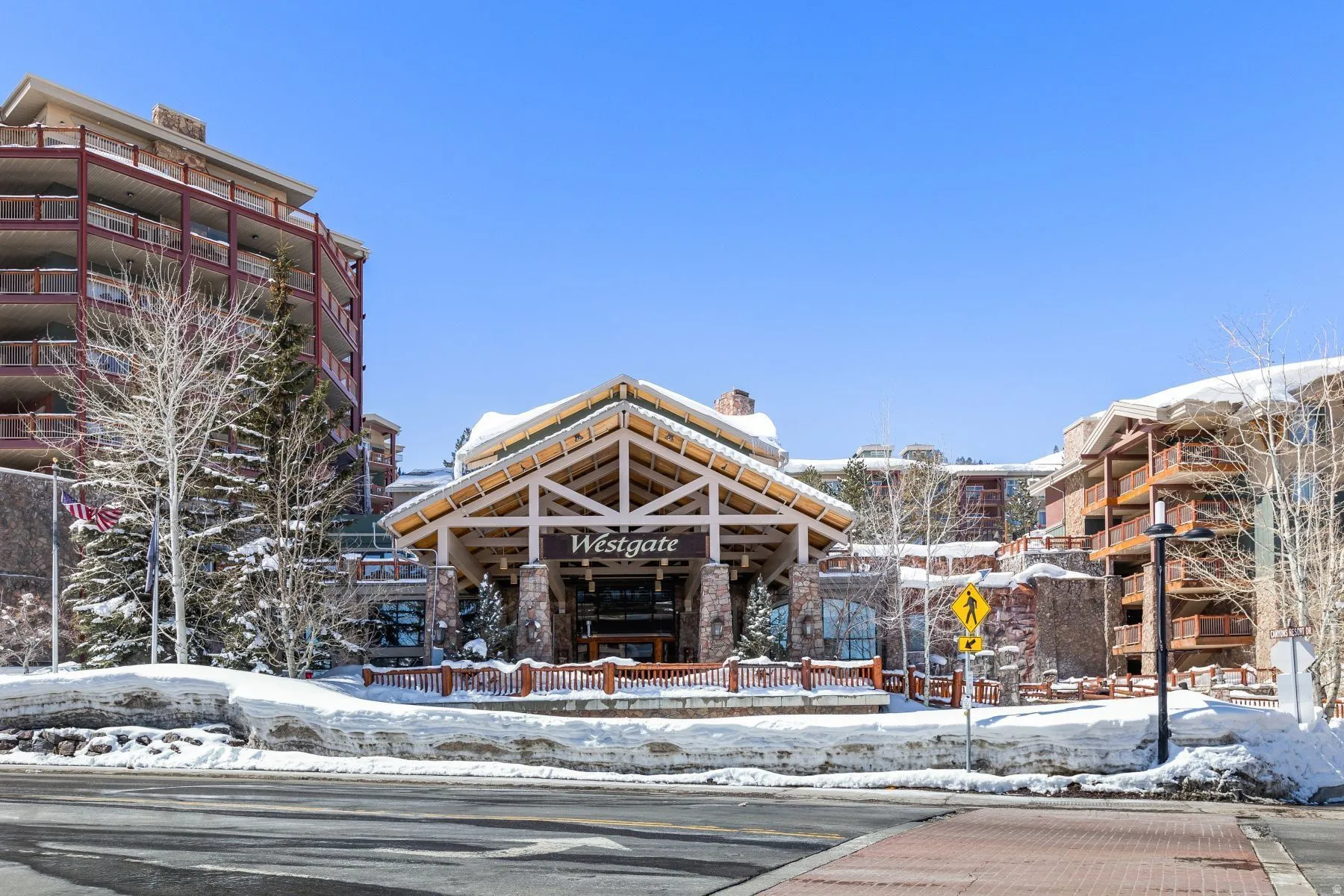 Mountain lodge-style architecture featuring stone and wood detailing