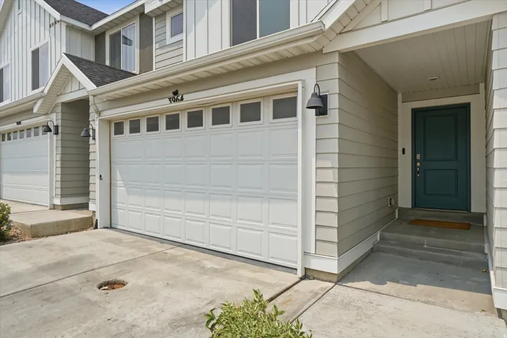 Two-car garage with paneling and upper windows
