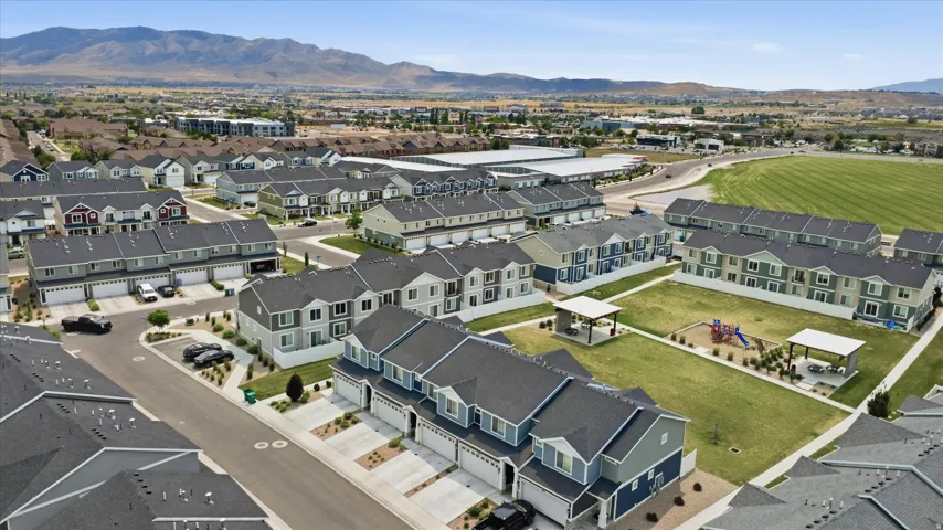 Residential community featuring multiple townhome structures with attached garages