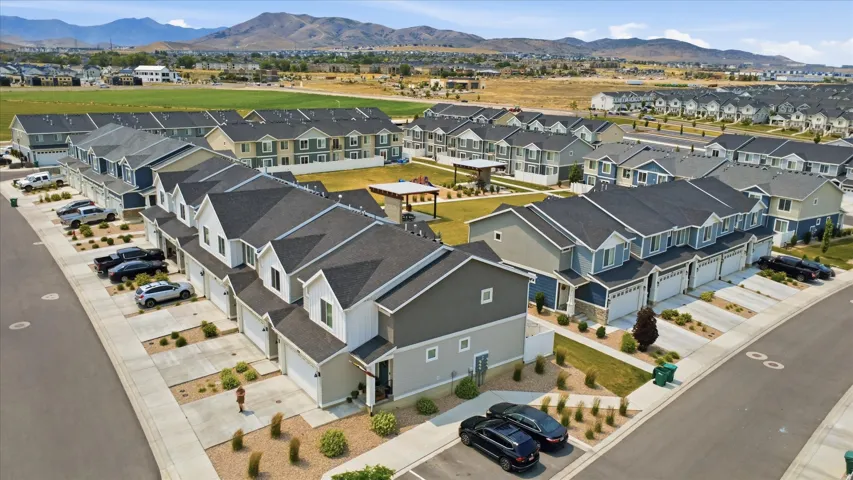 Modern townhome community featuring varied architectural styles and a central green space