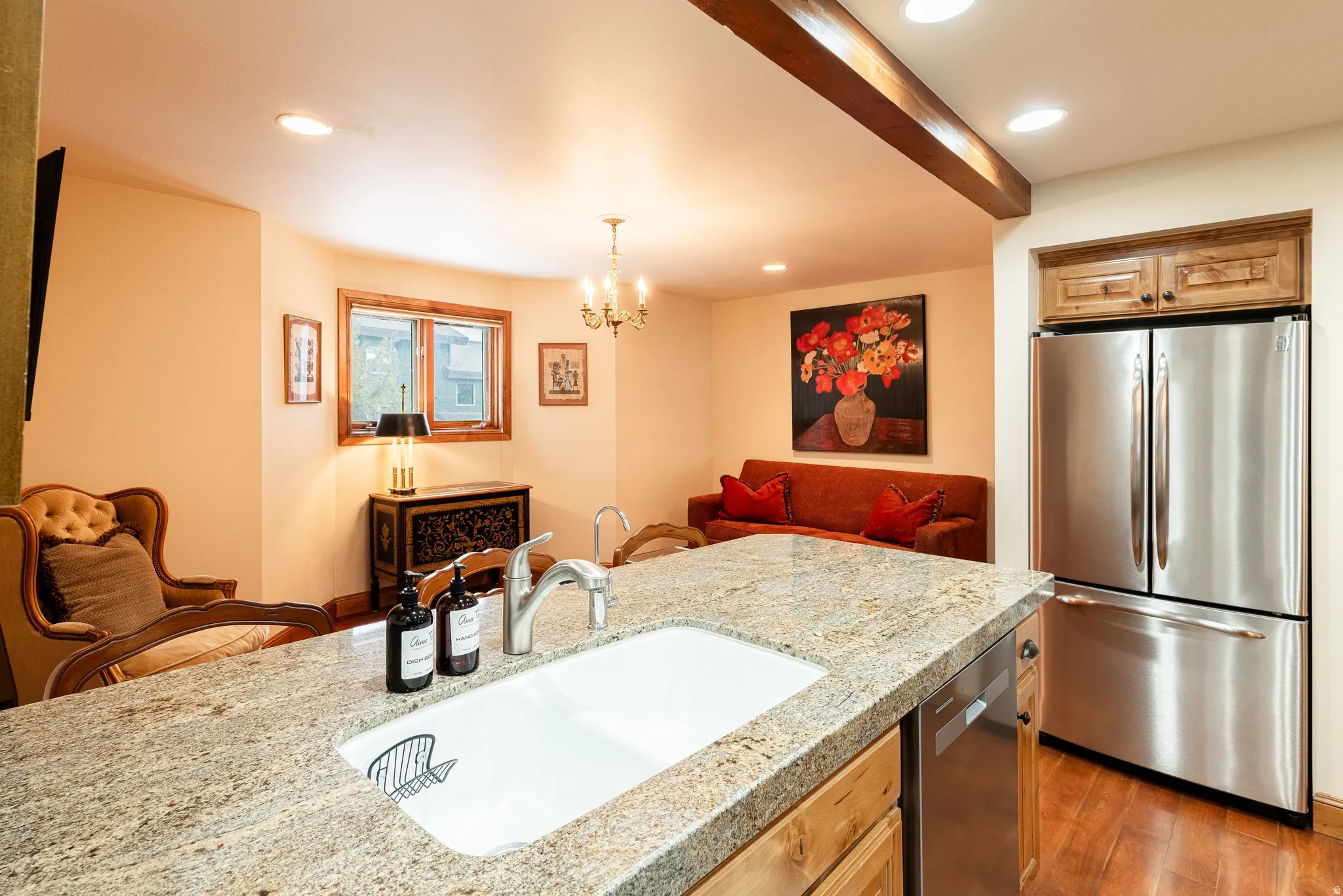 Kitchen island with a built-in sink and stone countertop