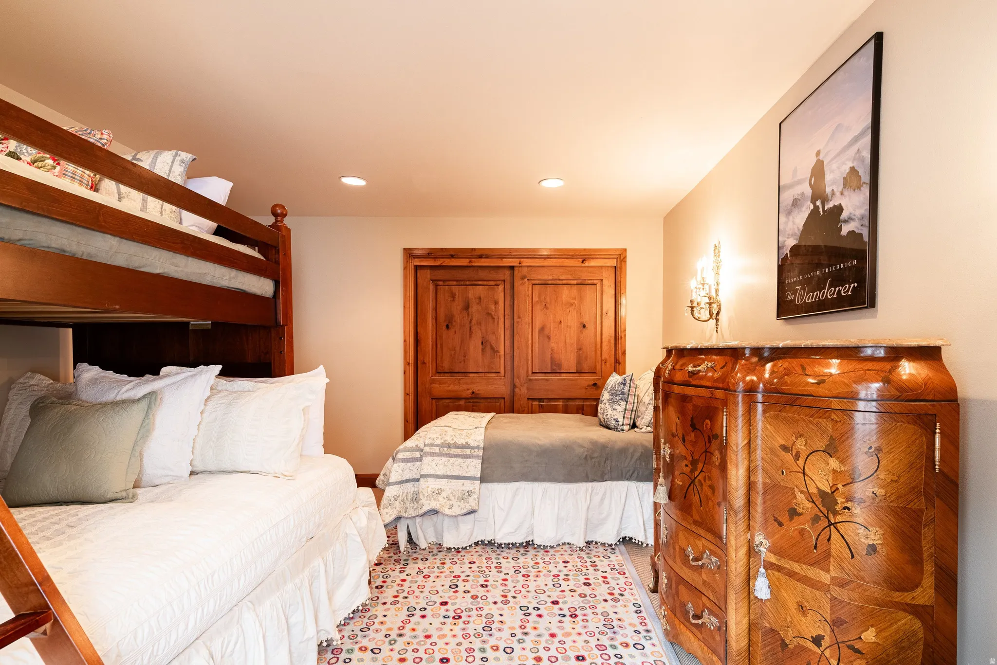Bedroom featuring natural wood bunk beds and a built-in daybed