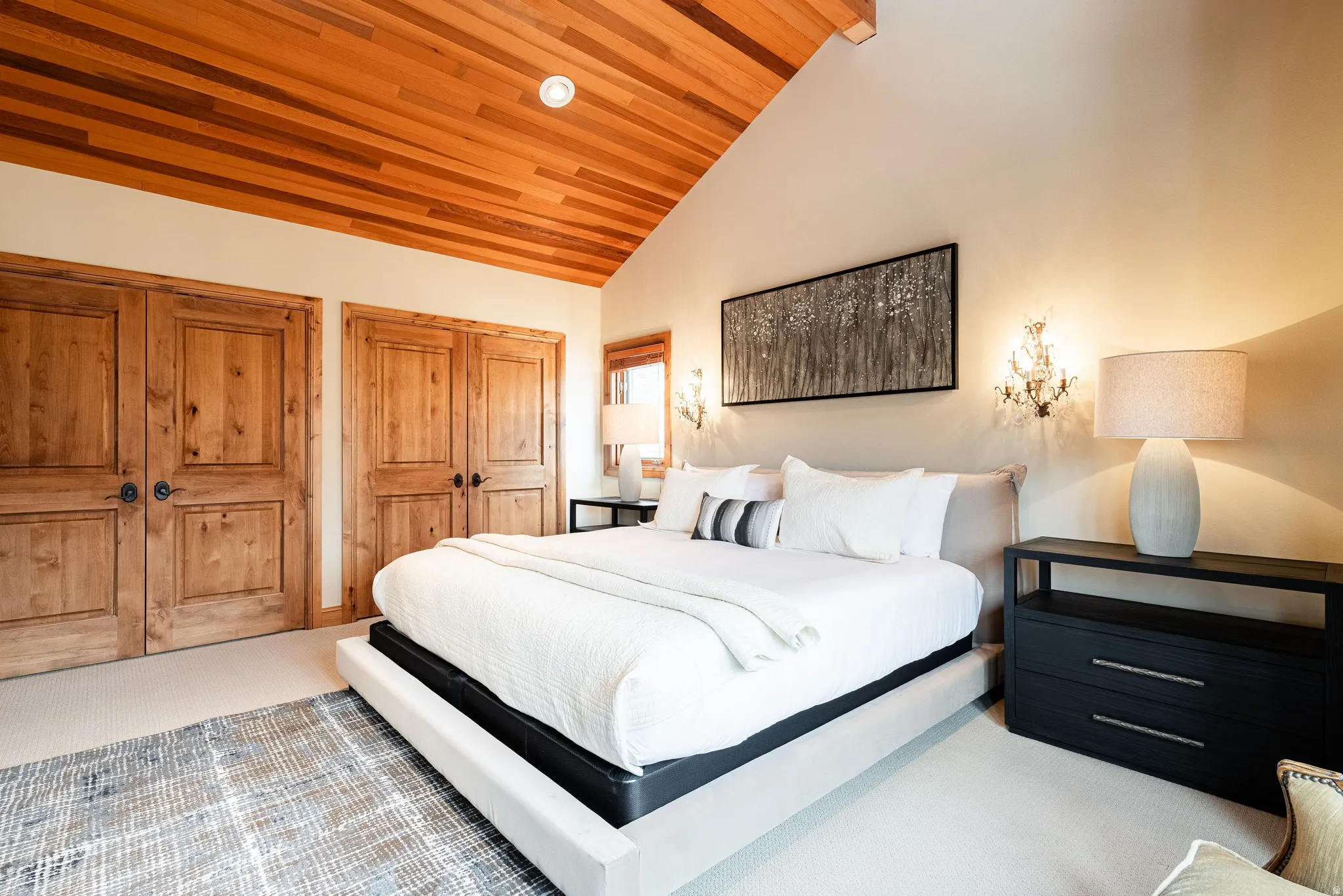 Vaulted wood-paneled ceiling with recessed lighting