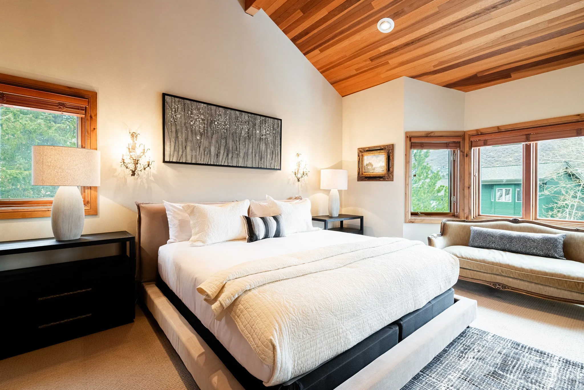 Vaulted wood-paneled ceiling with recessed lighting