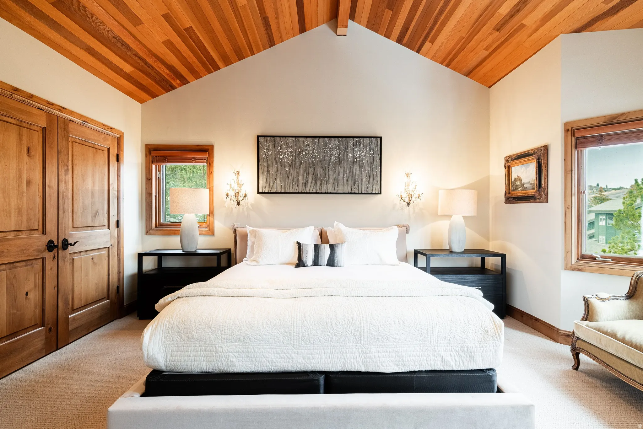 Vaulted wood-paneled ceiling accentuates the room's height