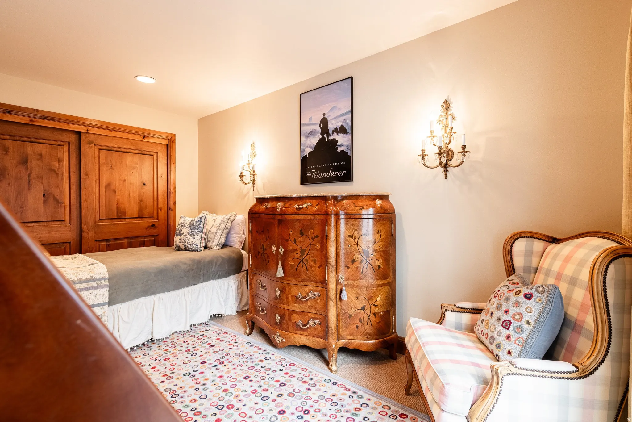 Recessed lighting illuminates wood-paneled closet doors