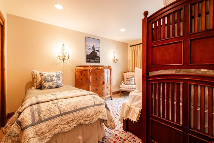 Interior space with recessed lighting and two ornate wall sconces