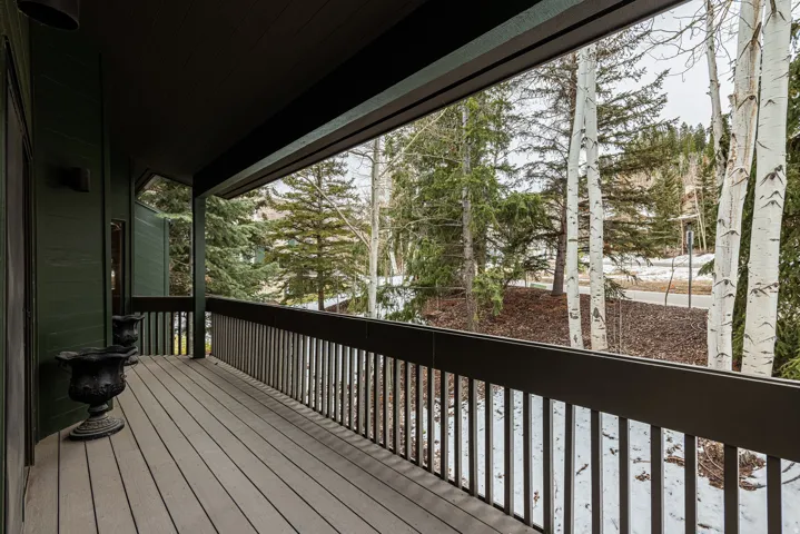 Spacious outdoor deck with composite decking and dark railings