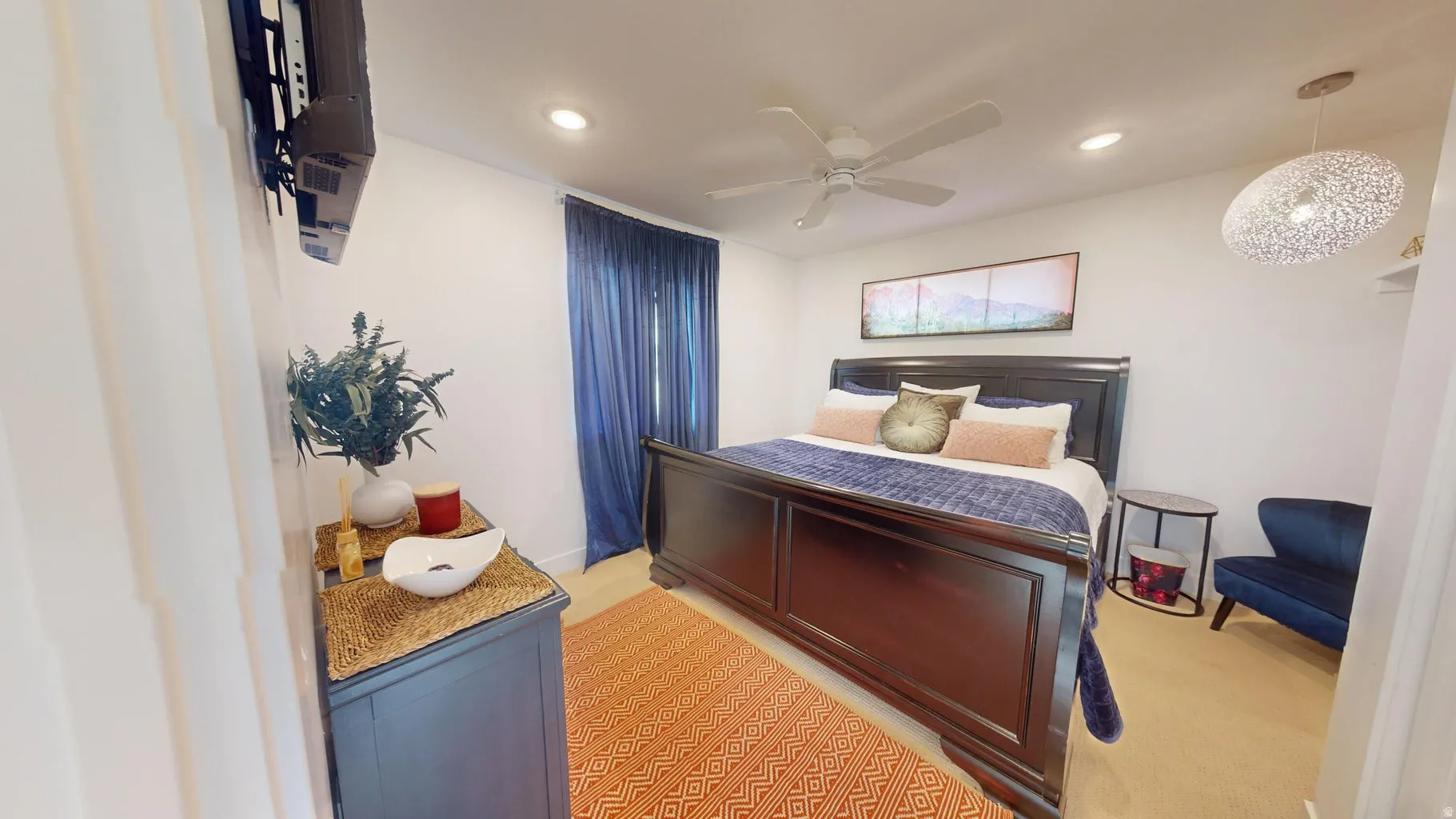 Bright interior room featuring a ceiling fan, recessed lighting, and wood-finish flooring