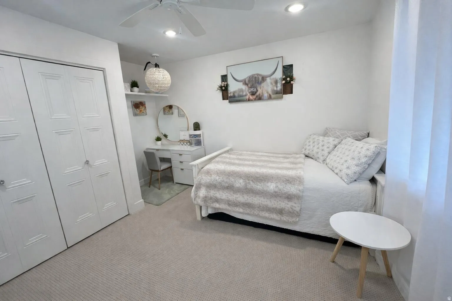 Carpeted room featuring a ceiling fan, recessed lighting, and white bi-fold closet doors