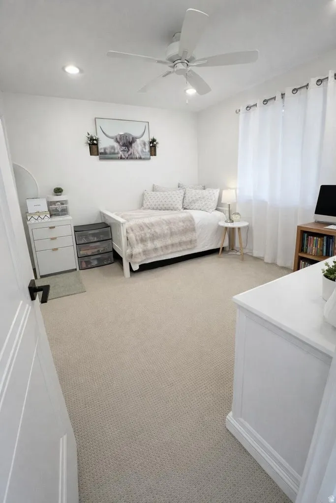 Room featuring recessed lighting, a ceiling fan, and light-colored carpeting