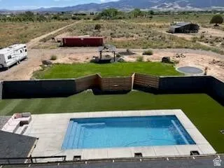 Rectangular swimming pool with concrete surround