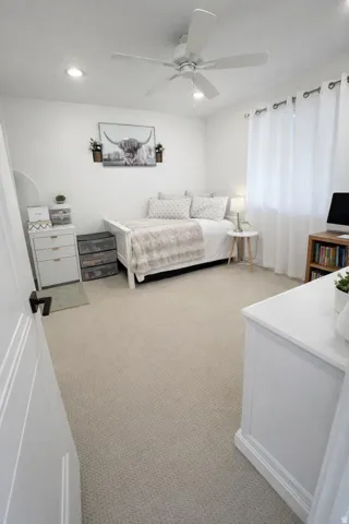 Room featuring recessed lighting, a ceiling fan, and light-colored carpeting