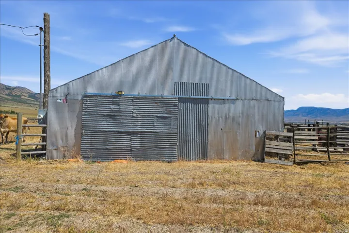 Corrugated metal barn structure with a pitched roof
