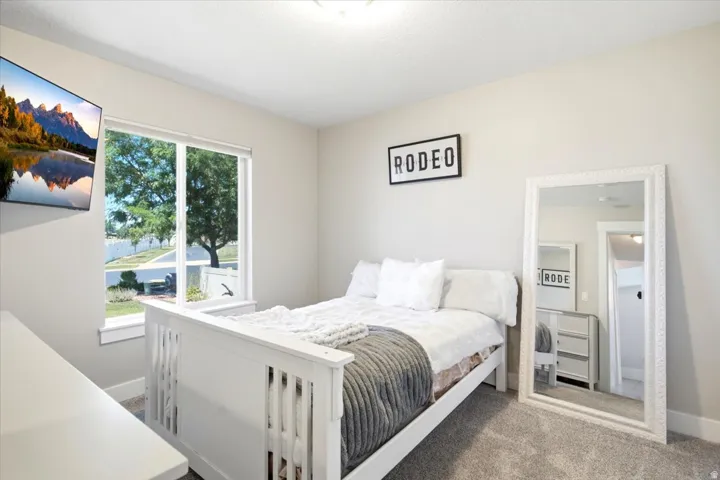 Room featuring neutral wall tones and a window with white trim