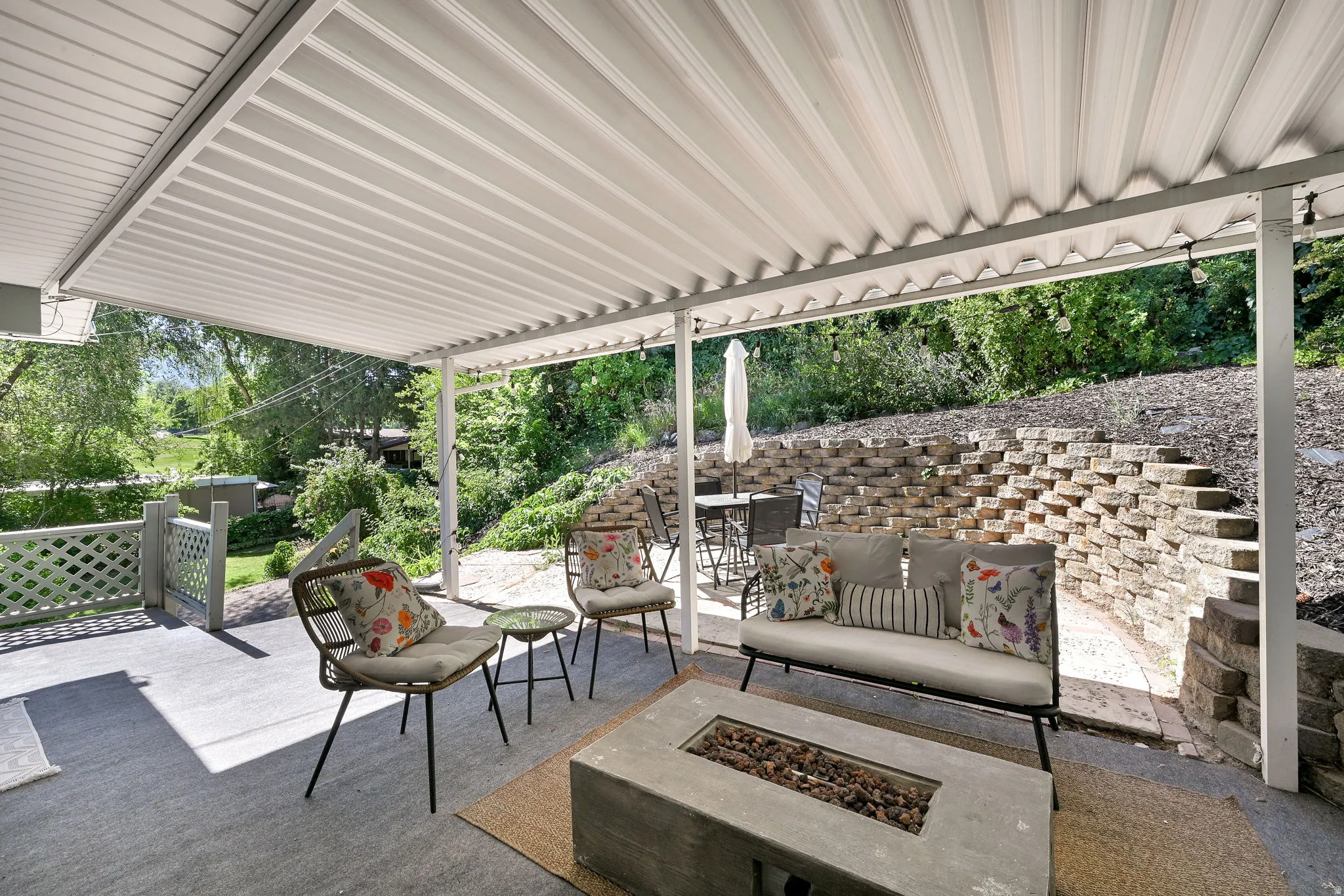 Covered patio featuring a corrugated white metal roof