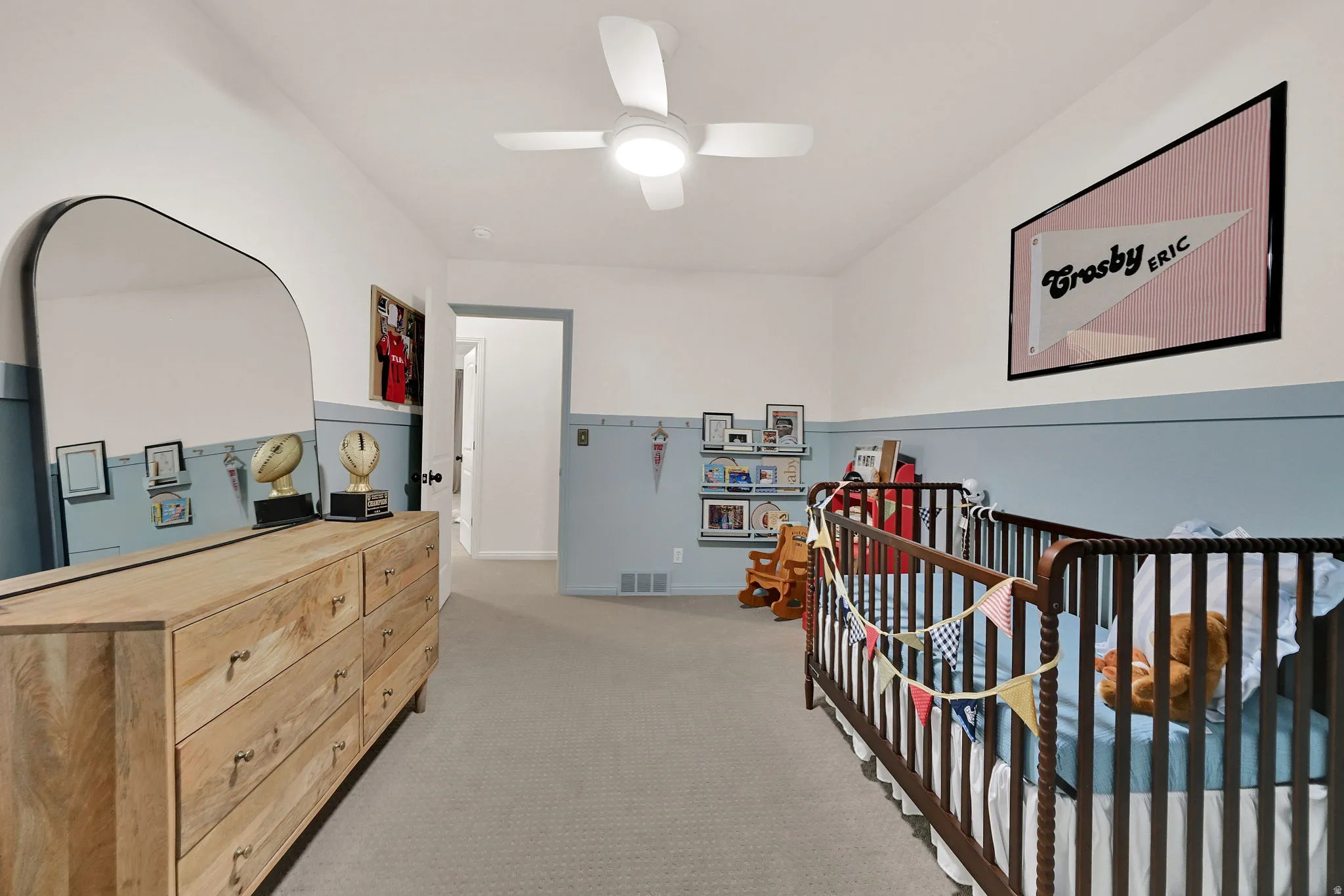 Bedroom #2 - Spacious room featuring neutral carpeting, a two-tone wall treatment, and a ceiling fan with integrated lighting