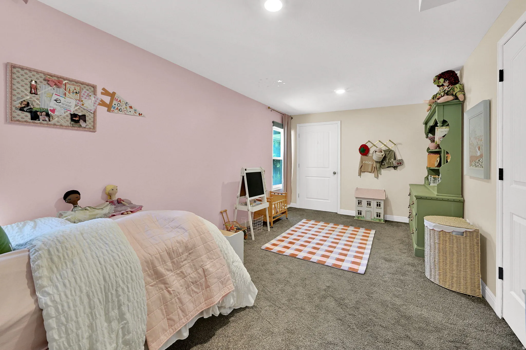 Bedroom #1 - Carpeted room featuring a window with natural light, recessed lighting, and two paneled doors