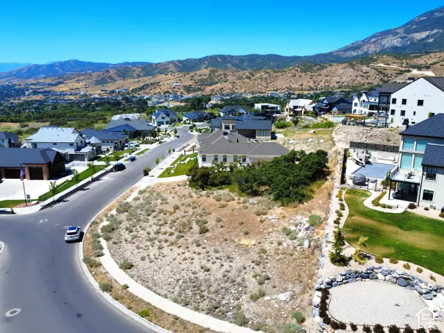 Expansive residential lot surrounded by established homes and mountain terrain