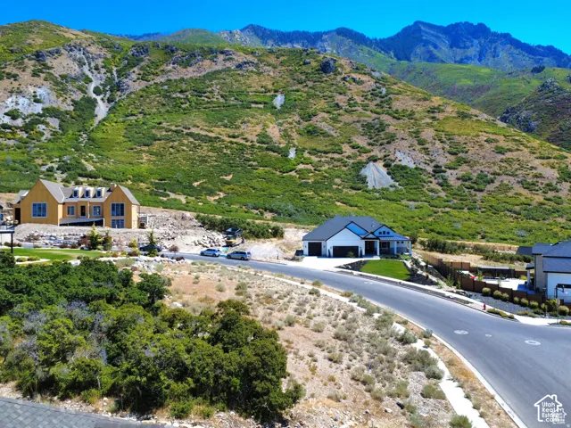 Mountainous backdrop setting for two residential properties
