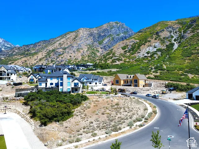 Hillside residential development with mountain backdrop