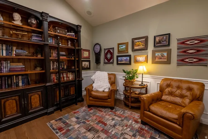 Built-in custom cabinetry with a rolling ladder system and integrated storage