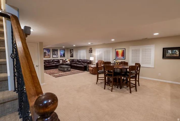 Lower level featuring recessed lighting, carpeting, and plantation-style window shutters