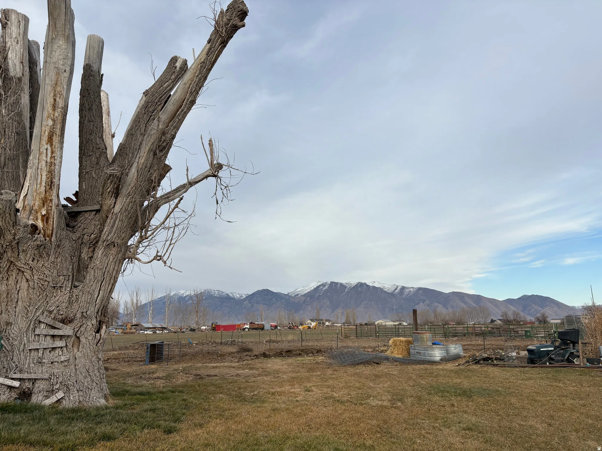 Expansive open land featuring distant snow-capped mountains