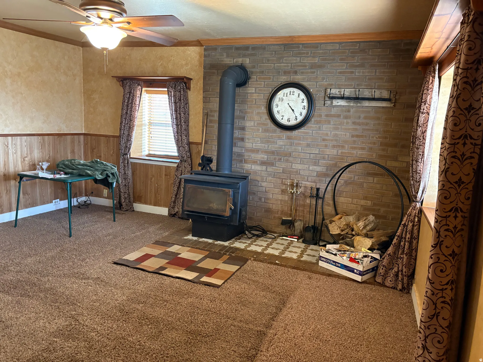 Brick accent wall with a black wood-burning stove