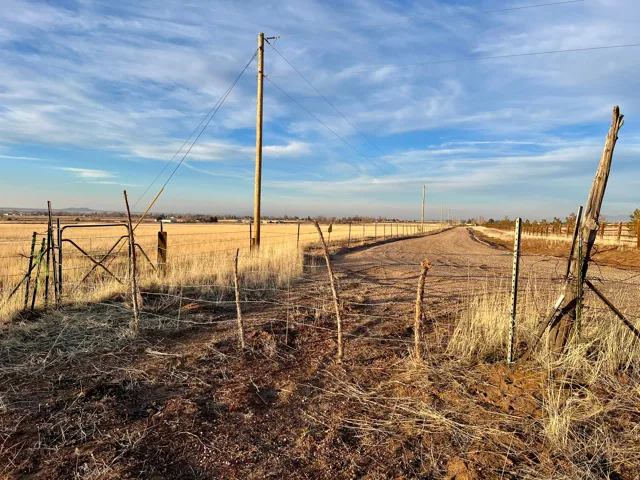 Northwest gate to 40 acre parcel. This is approximately 600 feet west of the property corner and is where the section marker is located.