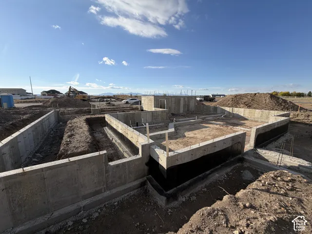 Poured concrete foundation with damp-proof coating and integrated plumbing rough-ins